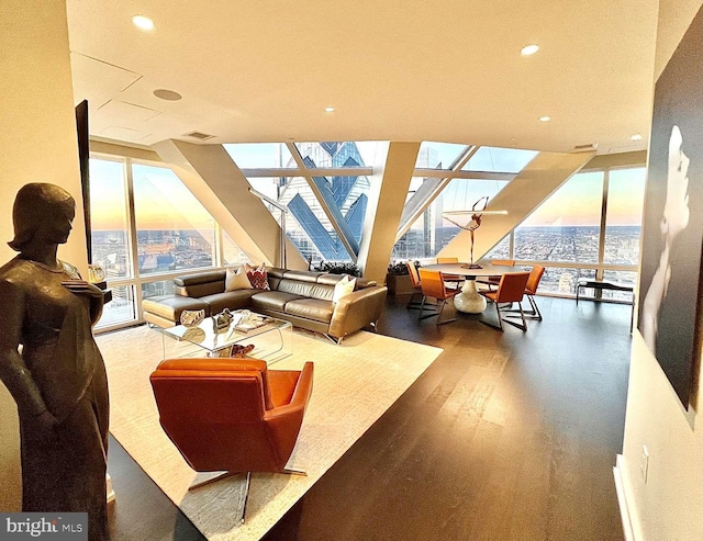 living room with dark hardwood / wood-style flooring and expansive windows