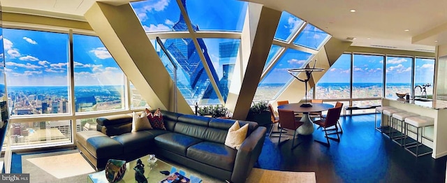 living room featuring expansive windows, a water view, dark hardwood / wood-style floors, and sink