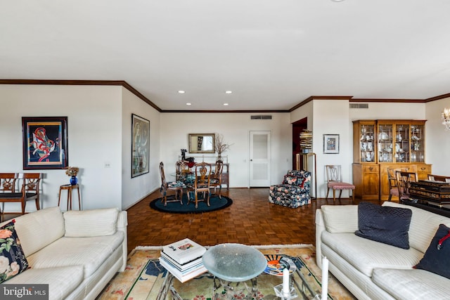 living room with crown molding, parquet floors, and a chandelier