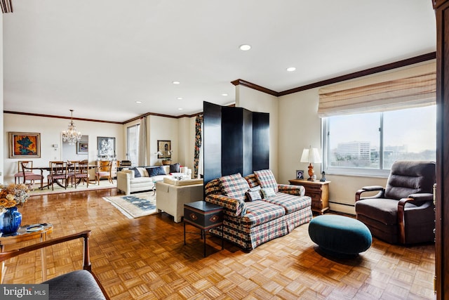 living room featuring a notable chandelier, ornamental molding, a baseboard heating unit, and light parquet flooring