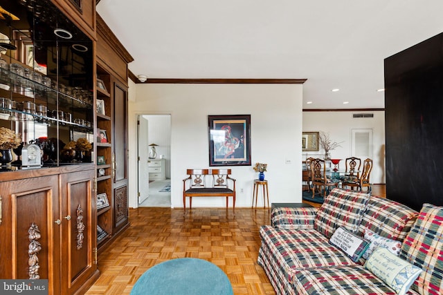 living room featuring crown molding and light parquet flooring