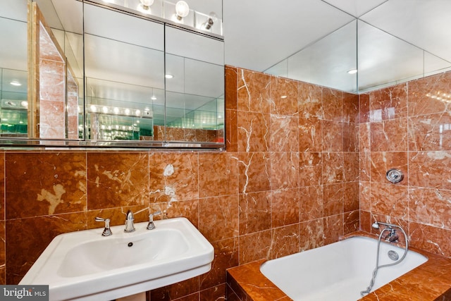 bathroom featuring tile walls and sink