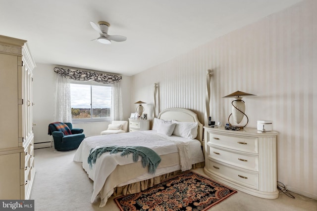 bedroom featuring light colored carpet, ceiling fan, and baseboard heating