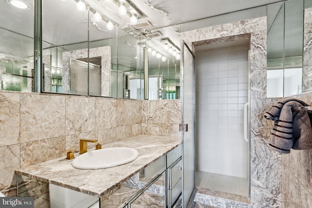 bathroom with backsplash, oversized vanity, and tile walls