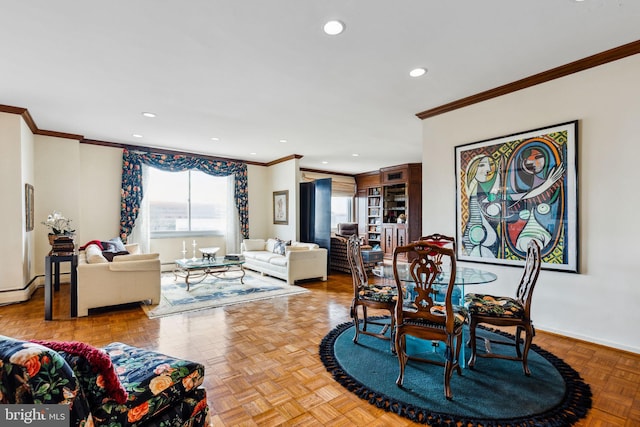 dining space with crown molding and light parquet floors