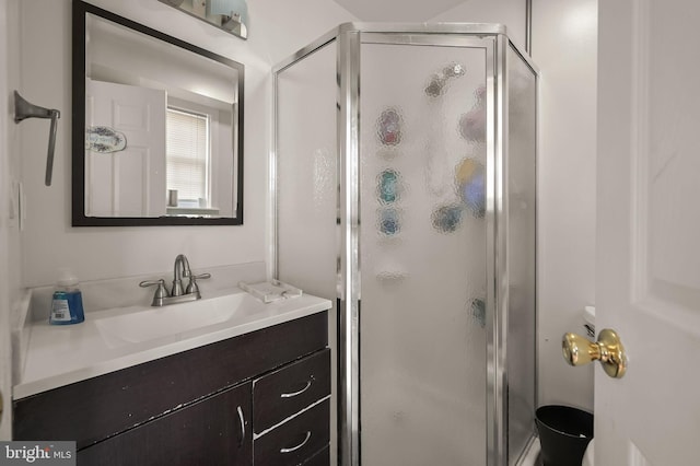 bathroom with vanity and an enclosed shower