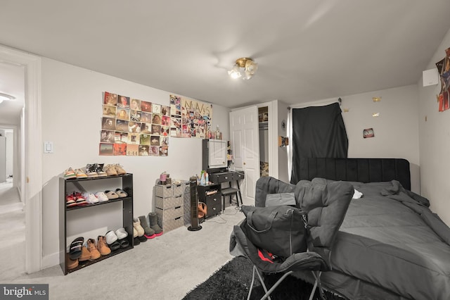 bedroom featuring light carpet