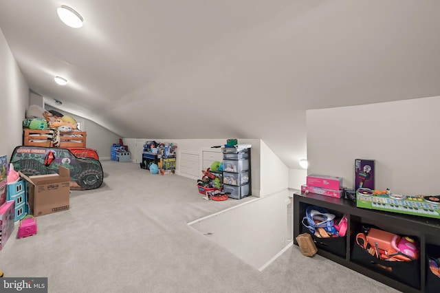 game room featuring vaulted ceiling and light carpet