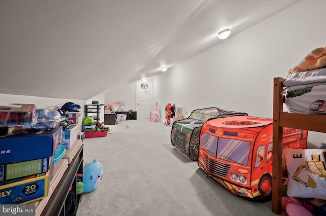 bedroom with vaulted ceiling and carpet