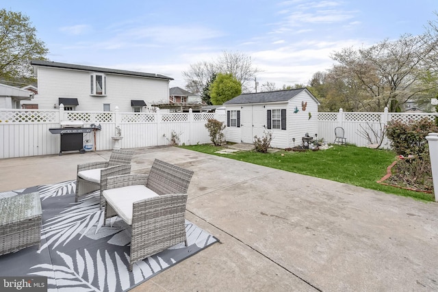 view of patio featuring an outdoor hangout area, an outdoor structure, and grilling area