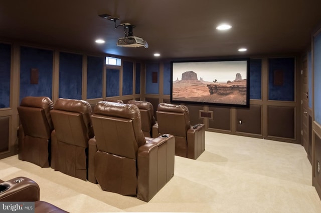 cinema room featuring light carpet