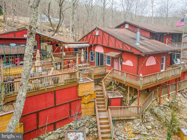 exterior space featuring a wooden deck