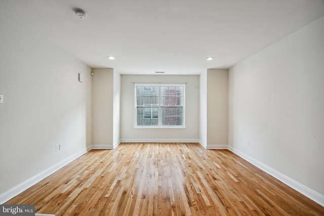 unfurnished room featuring light hardwood / wood-style flooring