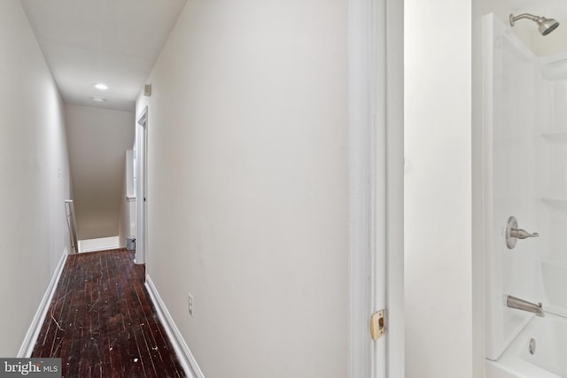 hall with dark hardwood / wood-style floors