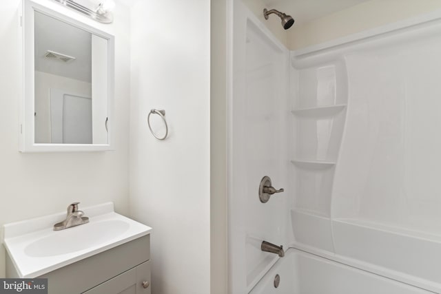 bathroom with shower / bathing tub combination and oversized vanity