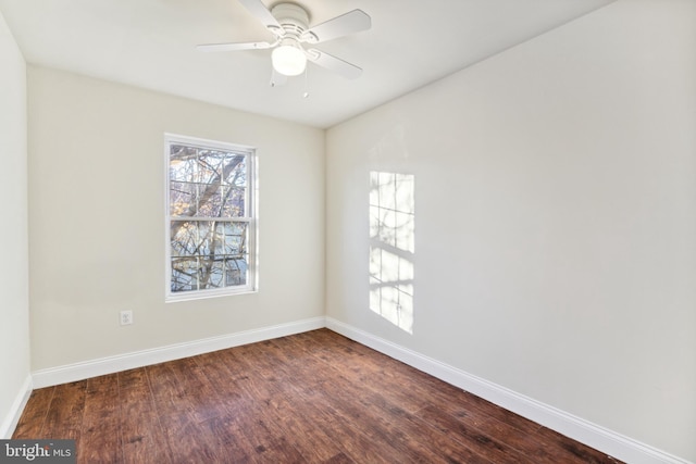 unfurnished room featuring ceiling fan and dark wood-type flooring