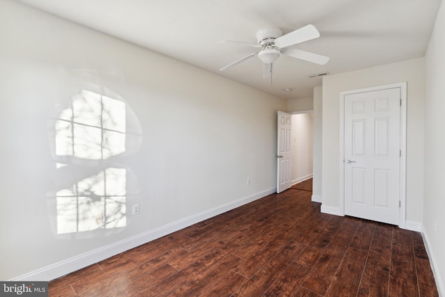 unfurnished room featuring ceiling fan and dark hardwood / wood-style floors