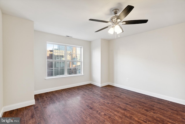 unfurnished room with ceiling fan and dark hardwood / wood-style floors