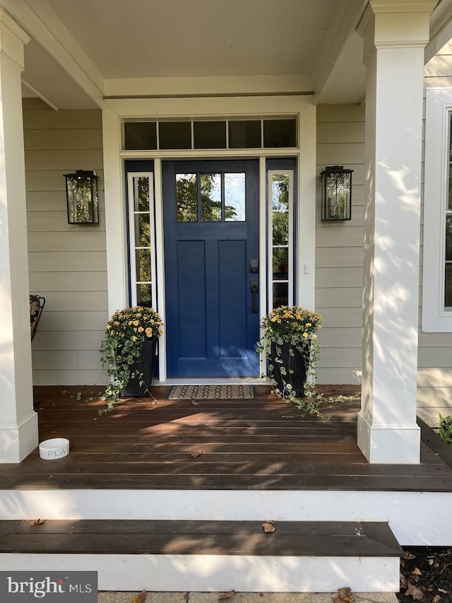 doorway to property featuring a porch