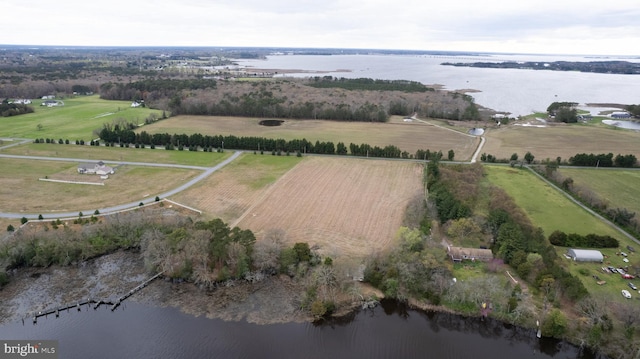 aerial view with a rural view and a water view