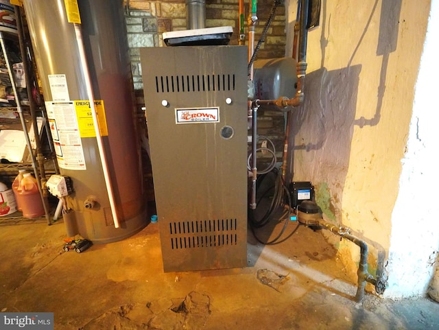 utility room featuring gas water heater and heating utilities