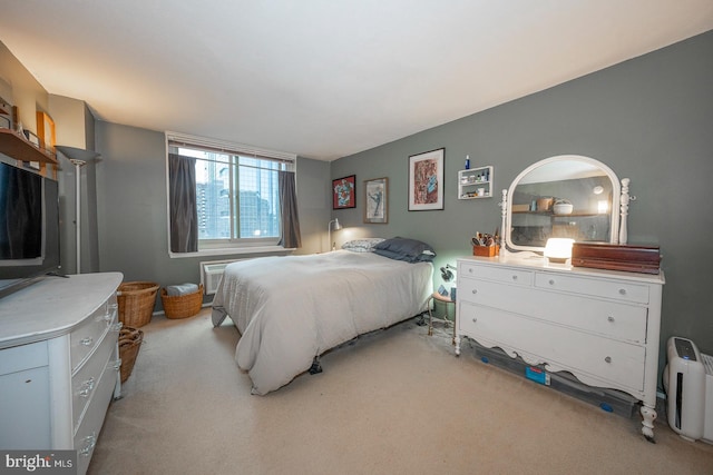 bedroom featuring light colored carpet