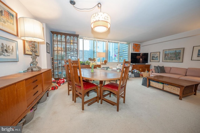 view of carpeted dining space