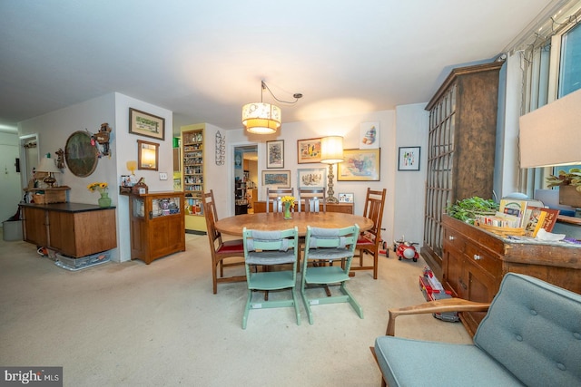 dining room with light carpet