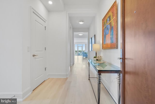 corridor featuring light hardwood / wood-style floors