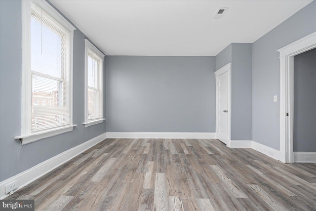 empty room featuring dark wood-type flooring