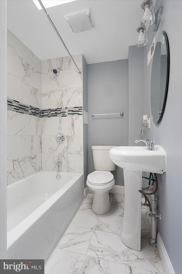 full bathroom with sink, tile flooring, toilet, and tiled shower / bath