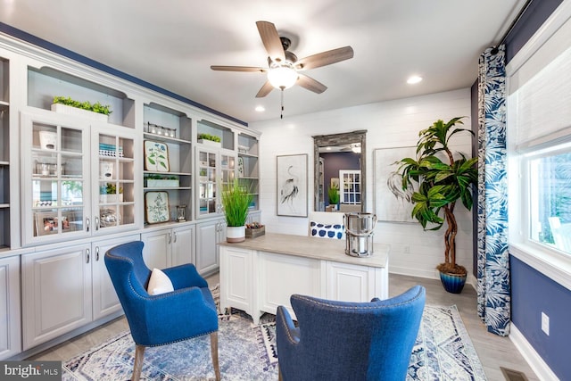 sitting room featuring ceiling fan and light hardwood / wood-style flooring