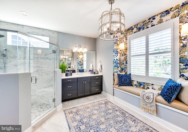 bathroom featuring a shower with door, an inviting chandelier, tile floors, and vanity