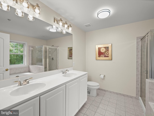 full bathroom featuring vanity, separate shower and tub, tile patterned floors, and toilet