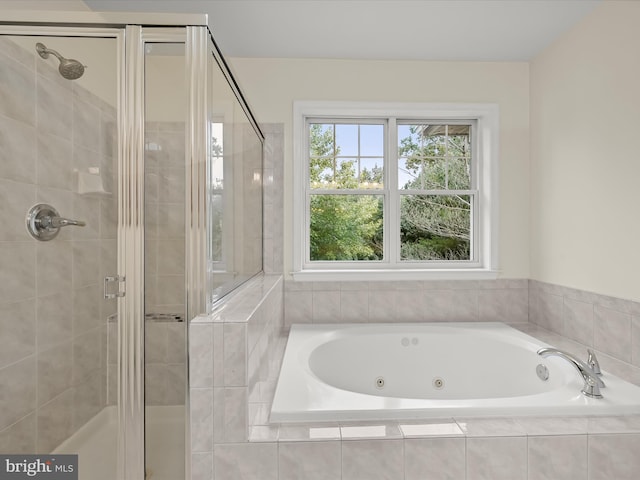 bathroom with separate shower and tub