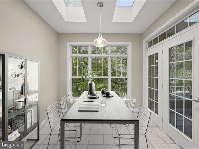 tiled dining area with a skylight