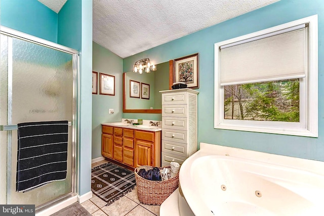 bathroom featuring tile floors, vanity, an enclosed shower, and a textured ceiling