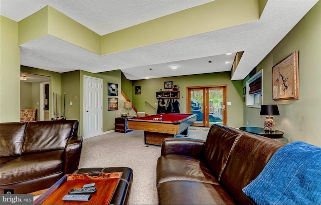 living room featuring a textured ceiling, light colored carpet, billiards, and french doors