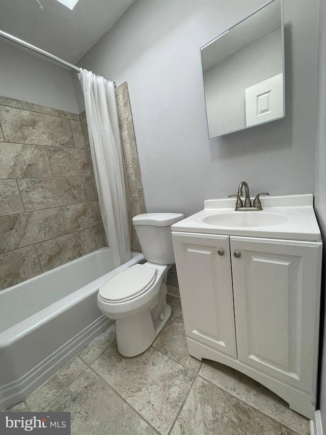 full bathroom featuring vanity, tile flooring, toilet, and shower / bath combination with curtain