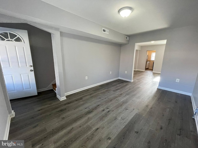 spare room featuring dark hardwood / wood-style flooring