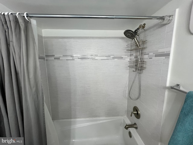 bathroom featuring shower / bath combo with shower curtain