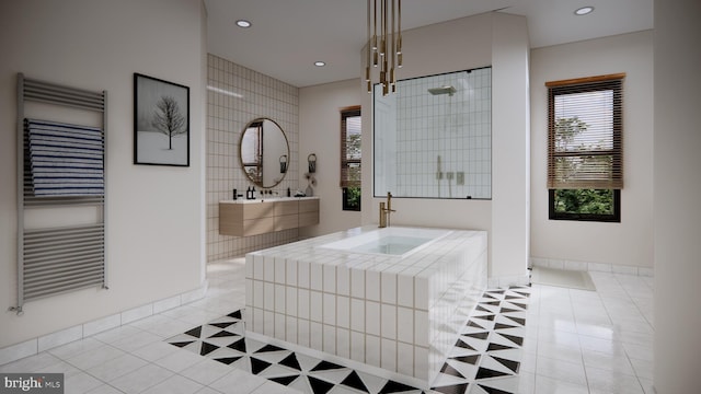 bathroom featuring tile flooring, radiator heating unit, and independent shower and bath