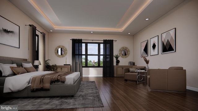 bedroom featuring dark hardwood / wood-style flooring and a raised ceiling