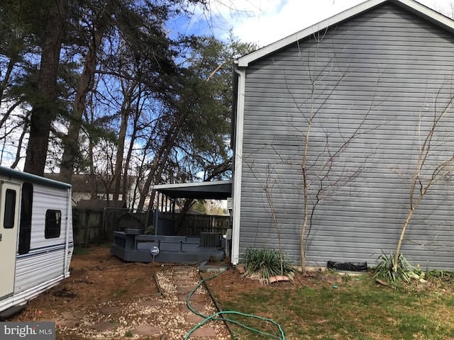 view of property exterior with central AC unit and a patio area