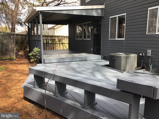 wooden terrace featuring central AC unit