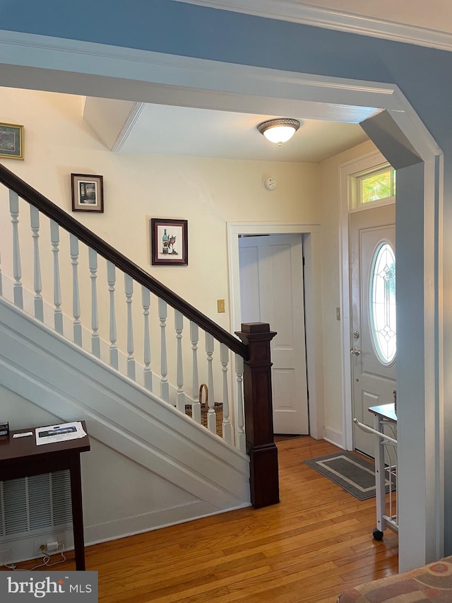 entryway with hardwood / wood-style flooring