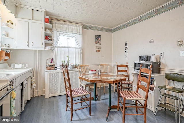 dining area with dark hardwood / wood-style flooring