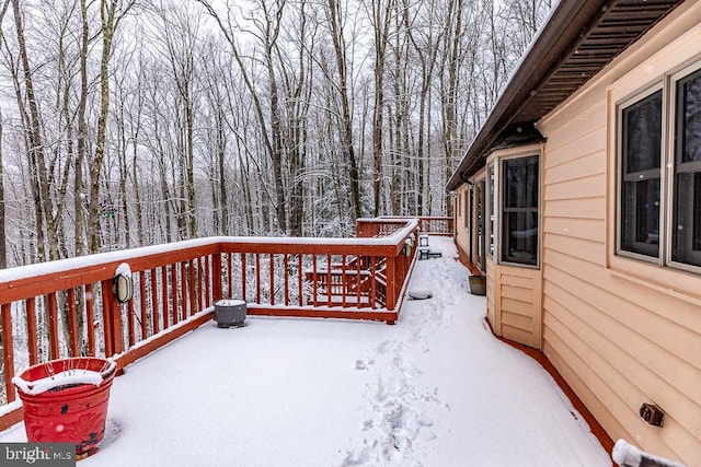 view of snow covered deck