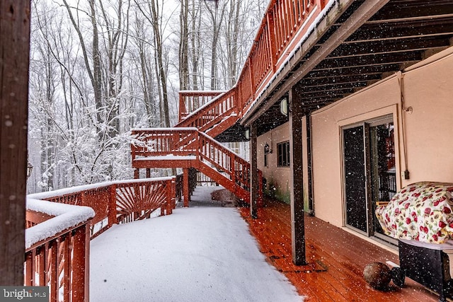 view of snow covered deck