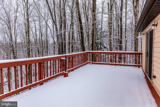 view of snow covered deck